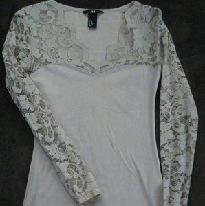 Rose colored long sleeve top.